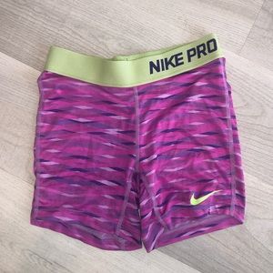 purple and green youth nike pros